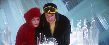 Movie still from “Superman II” (1980), directed by Richard Lester – A man and a woman are standing next to each other; Close Up shot, Low angle