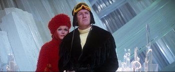 Movie still from “Superman II” (1980), directed by Richard Lester – A man and a woman wearing winter clothing; Medium shot, Low angle