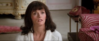 Movie still from “Superman II” (1980), directed by Richard Lester – A person wearing a white robe; Close Up shot, Over the shoulder angle