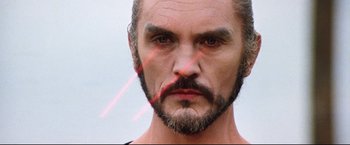 Movie still from “Superman II” (1980), directed by Richard Lester – A person with a beard; Close Up shot, Low angle