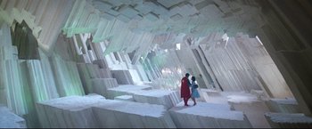 Movie still from “Superman II” (1980), directed by Richard Lester – Two people walking in a room made out of blocks; Extreme Wide shot, Overhead angle