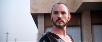 Movie still from “Superman II” (1980), directed by Richard Lester – A person with a beard; Close Up shot, Low angle