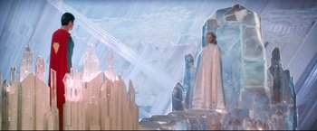 Movie still from “Superman II” (1980), directed by Richard Lester – A woman standing in front of an ice sculpture; Extreme Wide shot, High angle