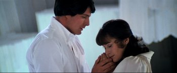 Movie still from “Superman II” (1980), directed by Richard Lester – A man and a woman are praying together; Close Up shot, Low angle