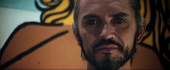 Movie still from “Superman II” (1980), directed by Richard Lester – A person with a beard; Close Up shot, Low angle