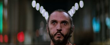 Movie still from “Superman II” (1980), directed by Richard Lester – A man with a surprised look on his face; Close Up shot, Low angle