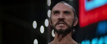 Movie still from “Superman II” (1980), directed by Richard Lester – A person with a beard; Close Up shot, Low angle