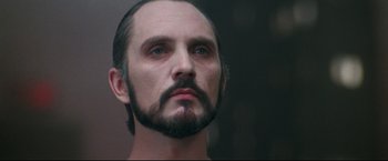 Movie still from “Superman II” (1980), directed by Richard Lester – A person with a beard; Close Up shot, Low angle
