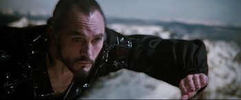 Movie still from “Superman II” (1980), directed by Richard Lester – A person wearing a leather jacket; Close Up shot, Low angle