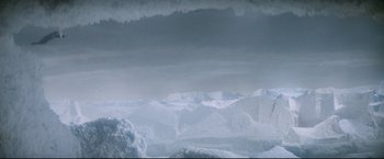 Movie still from “Superman II” (1980), directed by Richard Lester – A view of a mountain range with snow on it's slopes; Extreme Wide shot, Low angle