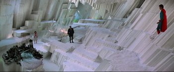 Movie still from “Superman II” (1980), directed by Richard Lester – A person standing in front of a wall made out of blocks; Extreme Wide shot, High angle