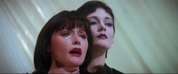 Movie still from “Superman II” (1980), directed by Richard Lester – Two women are standing next to each other; Close Up shot, Low angle