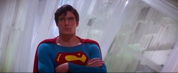 Movie still from “Superman II” (1980), directed by Richard Lester – A person wearing a superman costume; Medium shot, Low angle