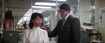 Movie still from “Superman II” (1980), directed by Richard Lester – A man and a woman are standing in a room together; Medium shot, Low angle