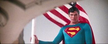 Movie still from “Superman II” (1980), directed by Richard Lester – A person wearing a superman costume; Medium shot, Low angle