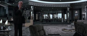 Movie still from “Superman III” (1983), directed by Richard Lester – A room filled with furniture and mirrors in it; Wide shot, High angle