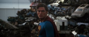 Movie still from “Superman III” (1983), directed by Richard Lester – A person wearing a superman costume; Medium shot, Over the shoulder angle