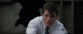 Movie still from “Superman III” (1983), directed by Richard Lester – A man in a white shirt and a black tie; Close Up shot, High angle