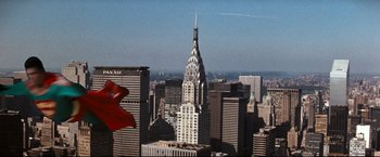 Movie still from “Superman III” (1983), directed by Richard Lester – A view of the chrysler building from the top of the empire state building; Extreme Wide shot, Low angle
