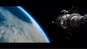 Movie still from “Superman IV: The Quest for Peace” (1987), directed by Sidney J. Furie – An image of an image of a space station in the space; Extreme Wide shot, Overhead angle