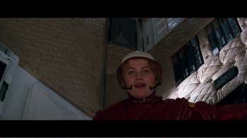 Movie still from “Superman IV: The Quest for Peace” (1987), directed by Sidney J. Furie – A woman wearing a helmet in a room; Close Up shot, Low angle