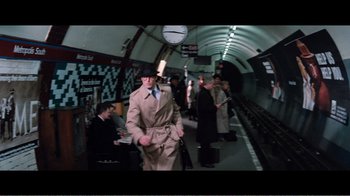 Movie still from “Superman IV: The Quest for Peace” (1987), directed by Sidney J. Furie – A group of people are walking down a train platform; Wide shot, High angle