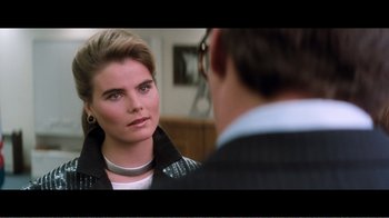 Movie still from “Superman IV: The Quest for Peace” (1987), directed by Sidney J. Furie – A woman looking at a man in the mirror; Close Up shot, Over the shoulder angle