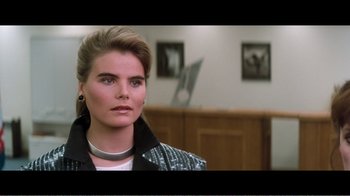Movie still from “Superman IV: The Quest for Peace” (1987), directed by Sidney J. Furie – A person wearing a jacket; Close Up shot, Over the shoulder angle