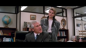 Movie still from “Superman IV: The Quest for Peace” (1987), directed by Sidney J. Furie – A man and a woman are in a room together; Medium shot, Over the shoulder angle