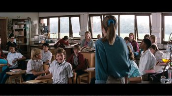 Movie still from “Superman IV: The Quest for Peace” (1987), directed by Sidney J. Furie – A group of children sitting in a classroom; Wide shot, Over the shoulder angle
