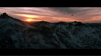 Movie still from “Superman IV: The Quest for Peace” (1987), directed by Sidney J. Furie – A helicopter flying over a mountain range at sunset; Extreme Wide shot, High angle