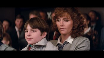Movie still from “Superman IV: The Quest for Peace” (1987), directed by Sidney J. Furie – A woman and a young boy sitting next to each other; Close Up shot, Over the shoulder angle