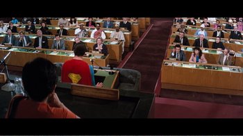 Movie still from “Superman IV: The Quest for Peace” (1987), directed by Sidney J. Furie – A group of people sitting in a room; Wide shot, High angle