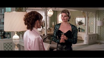 Movie still from “Superman IV: The Quest for Peace” (1987), directed by Sidney J. Furie – Two women are talking to each other in a living room; Medium shot, Over the shoulder angle