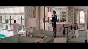 Movie still from “Superman IV: The Quest for Peace” (1987), directed by Sidney J. Furie – A woman in a black leather outfit standing in front of a bar; Wide shot, High angle