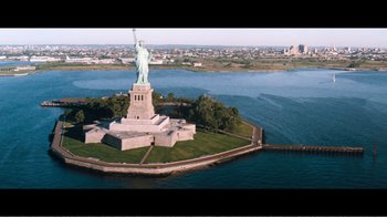 Movie still from “Superman IV: The Quest for Peace” (1987), directed by Sidney J. Furie – An aerial view of the statue of liberty in new york city; Extreme Wide shot, High angle
