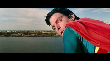 Movie still from “Superman IV: The Quest for Peace” (1987), directed by Sidney J. Furie – A person wearing a superman costume; Close Up shot, Over the shoulder angle