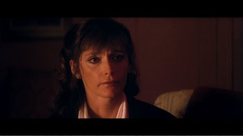 Movie still from “Superman IV: The Quest for Peace” (1987), directed by Sidney J. Furie – A person wearing a jacket; Close Up shot, Over the shoulder angle