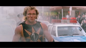 Movie still from “Superman IV: The Quest for Peace” (1987), directed by Sidney J. Furie – A man that is standing in the street; Medium shot, Over the shoulder angle