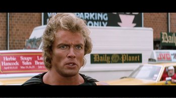 Movie still from “Superman IV: The Quest for Peace” (1987), directed by Sidney J. Furie – A man that is looking into the camera; Close Up shot, Over the shoulder angle