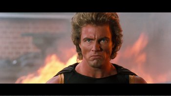 Movie still from “Superman IV: The Quest for Peace” (1987), directed by Sidney J. Furie – A person with a fire in the background; Close Up shot, Low angle