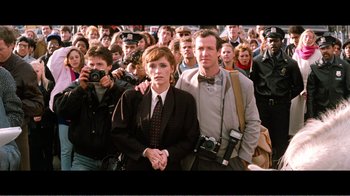 Movie still from “Superman IV: The Quest for Peace” (1987), directed by Sidney J. Furie – A man and a woman standing next to each other; Medium shot, High angle