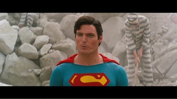 Movie still from “Superman IV: The Quest for Peace” (1987), directed by Sidney J. Furie – A person wearing a superman costume; Medium shot, Over the shoulder angle