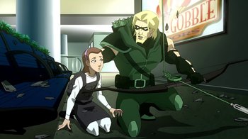 Movie still from “Superman/Shazam!: The Return of Black Adam” (2010), directed by Joaquim Dos Santos – A woman sitting on the ground next to an arrow; Medium shot, Over the shoulder angle