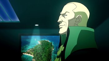 Movie still from “Superman/Shazam!: The Return of Black Adam” (2010), directed by Joaquim Dos Santos – An image of a man looking at a computer screen; Medium shot, Low angle