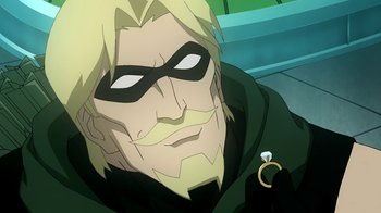 Movie still from “Superman/Shazam!: The Return of Black Adam” (2010), directed by Joaquim Dos Santos – A person wearing a mask and holding a ring; Close Up shot, Over the shoulder angle