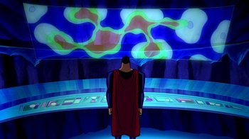 Movie still from “Superman: Doomsday” (2007), directed by Bruce Timm – A man standing in front of a wall with lights on it; Wide shot, High angle