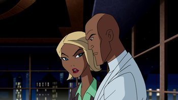 Movie still from “Superman: Doomsday” (2007), directed by Bruce Timm – A man and a woman standing next to each other; Medium shot, Over the shoulder angle
