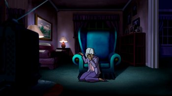 Movie still from “Superman: Doomsday” (2007), directed by Bruce Timm – An animated person sitting on the ground in a room; Wide shot, High angle