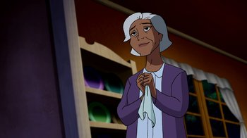 Movie still from “Superman: Doomsday” (2007), directed by Bruce Timm – An old woman is holding her hands up to her chest; Medium shot, Over the shoulder angle